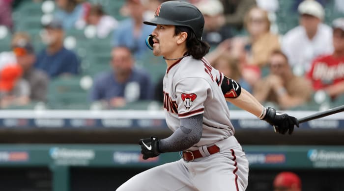 Arizona Diamondbacks left fielder Corbin Carroll looks on as he hits a triple against the Detroit Tigers.